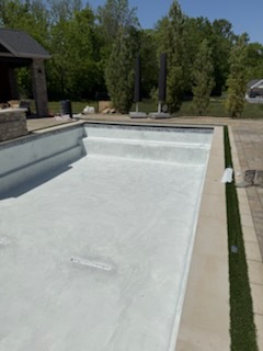 New white plaster finish in a rectangular pool ready for water