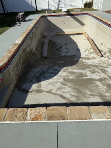 Pool shell stripped to bare surface during a full remodel